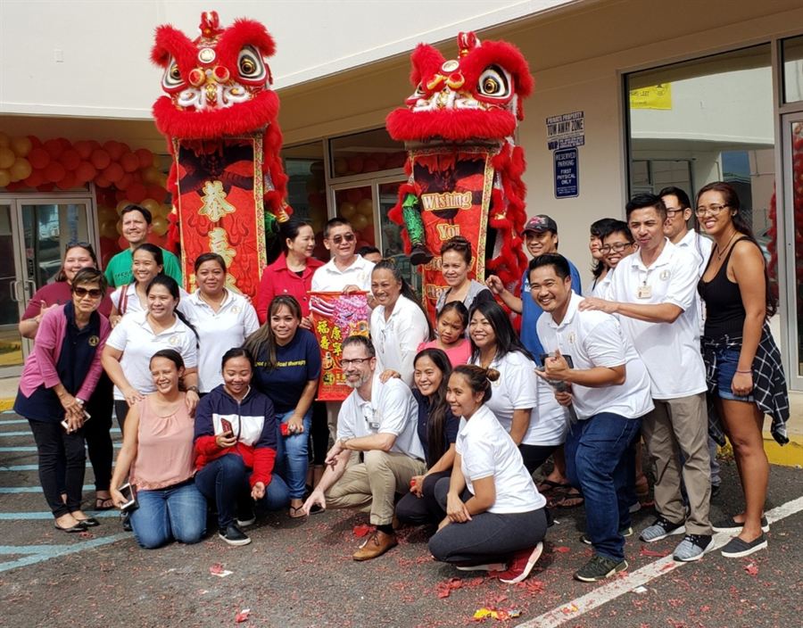 A lion dance blessing outside the clinic